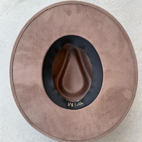 Brown cow print rancher style cowboy hat